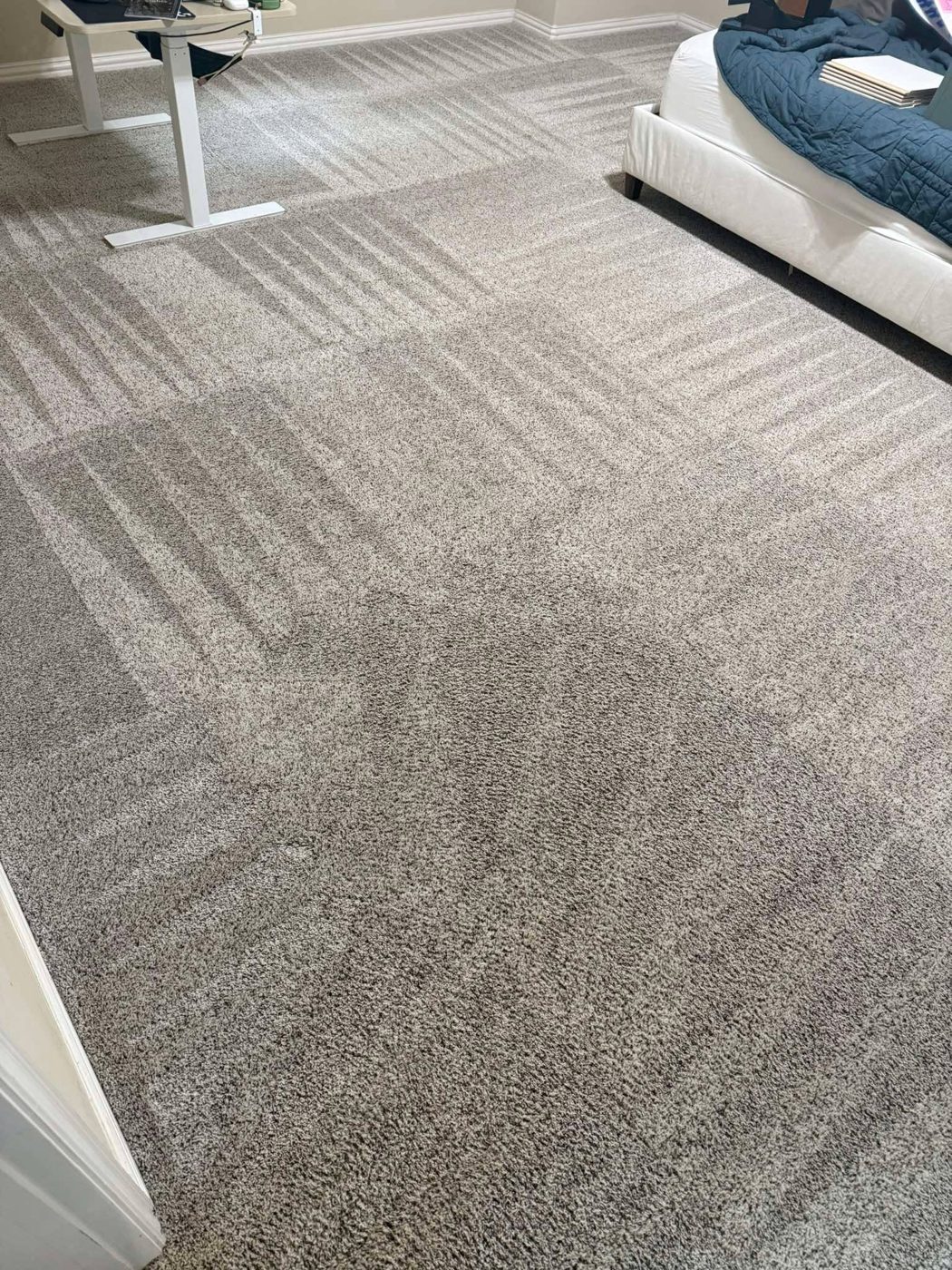 Professionally cleaned grey carpet in an East Bay bedroom